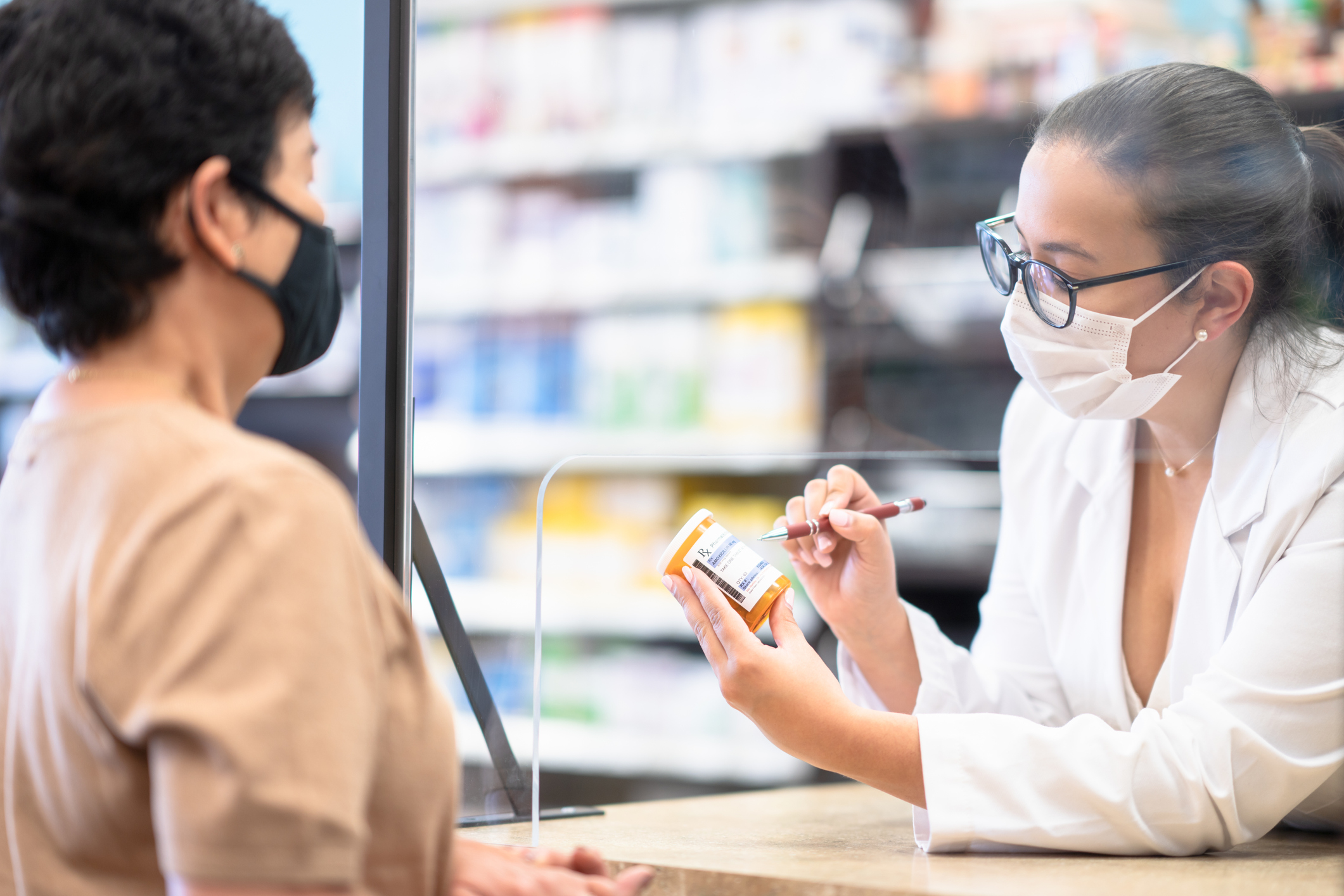 Female Pharmacist Speaking to a Customer in hospital or health system