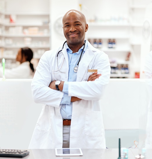 male pharmacist happy with reporting functionality
